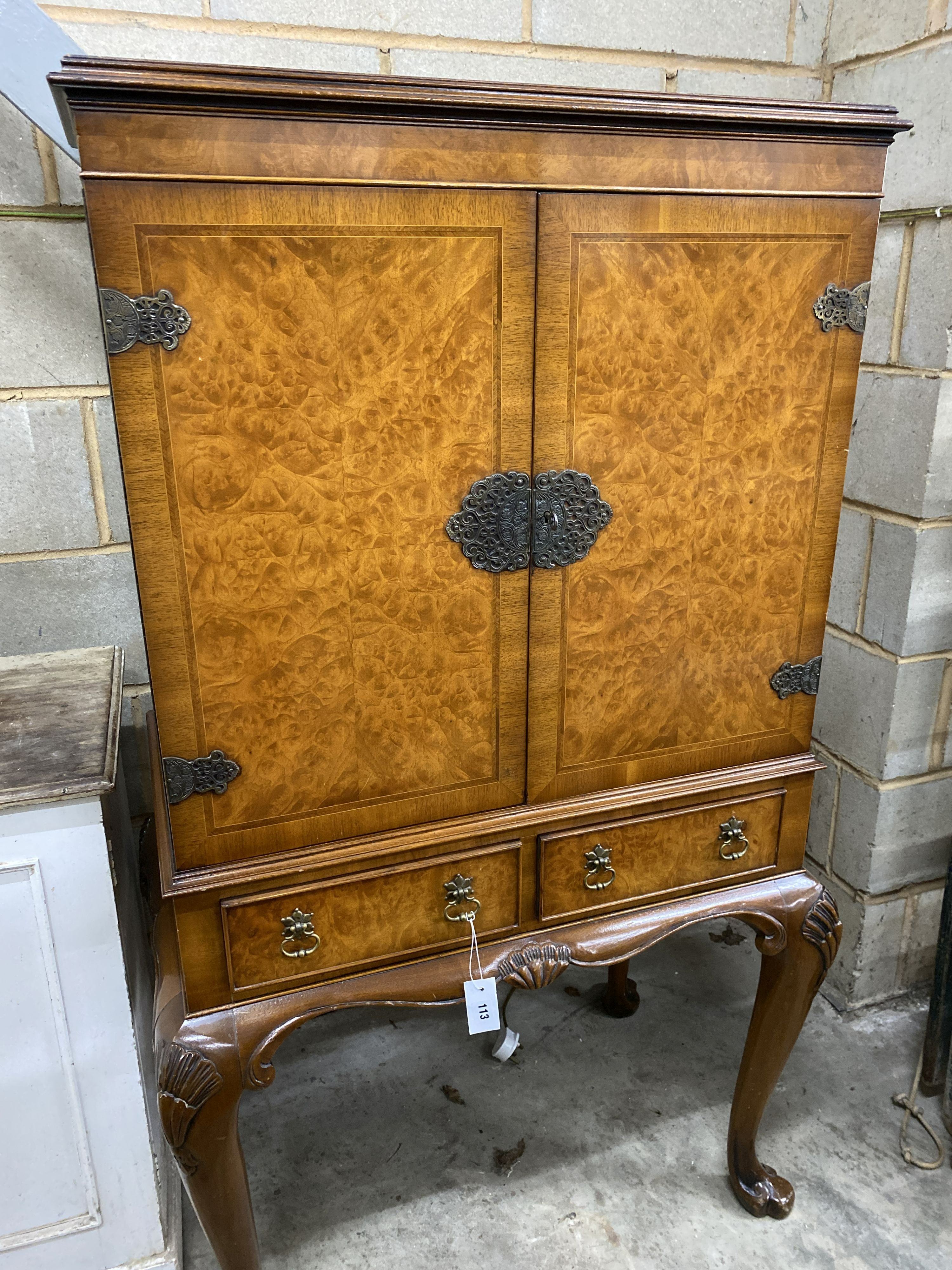 A Queen Anne style walnut cocktail cabinet, width 84cm, depth 52cm, height 147cm